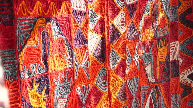 Colorful textiles showcase traditional craftsmanship in vibrant market