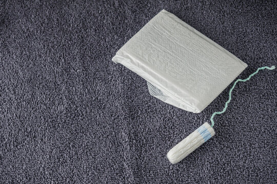 Contraception and hygiene products on a gray background