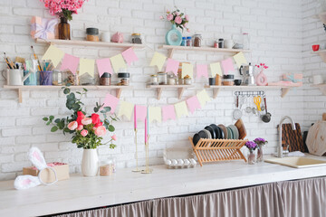 Interior of kitchen with table served for Easter celebration