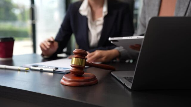 Business people and lawyers discussing contract papers sitting in the table at office in the morning. concepts of law, advice, legal services.