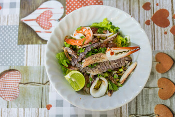 A bowl of special food of dry egg yellow noodle with crawfish, shrimp and crab, sold in Chanthaburi province, Thailand