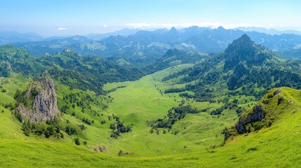 Obraz premium Panoramic view of lush green valley, mountains, and blue sky. Ideal for travel brochures