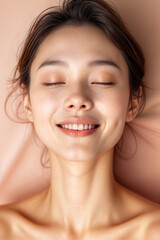 Obraz premium Relaxed Woman Smiling, Soft Pink Background, Natural Beauty & Skincare Serenity