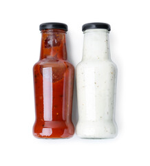 Different delicious sauces in glass bottles isolated on white, top view