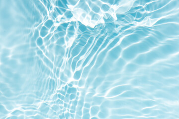 Blue water with ripples on the surface. Defocus blurred transparent blue colored clear calm water...
