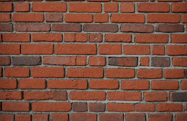 Red brick wall with visible mortar lines, classic texture