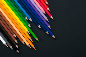 color pencils on black background