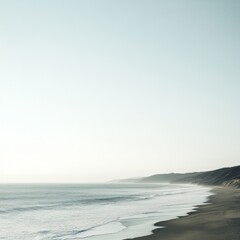 Serene coastal landscape with gentle waves and distant hills