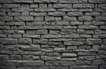 Obraz premium Gray brick wall with a rough texture, industrial feel
