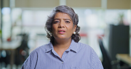 Indian Asian gen x old aged older woman lady look cam do work talk chat share idea new plan online...