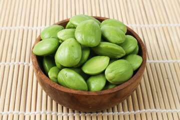 Fresh Green Parkia Speciosa in Wooden Bowl