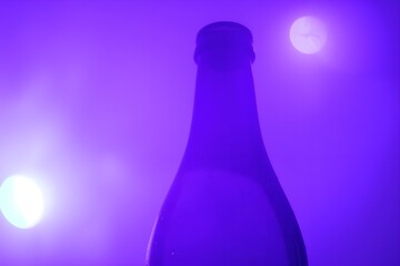 Vibrant purple champagne bottle with selective focus, isolated on glowing background. Perfect for New Year’s Eve, celebrations, or festive drink ads with luxurious macro close-up
