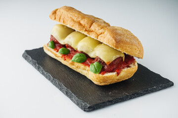 delicious traditional Italian meatball sandwich polpette in ciabatta on a white background