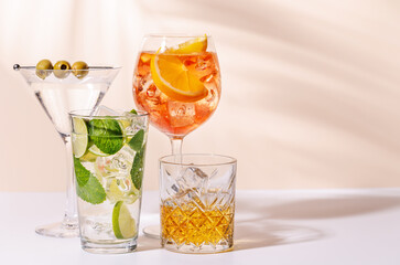 A vibrant display of cocktails, including Aperol Spritz, Mojito, and Martini