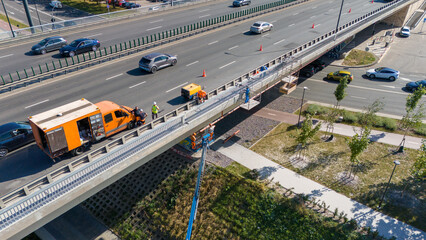 Highway Bridge Maintenance with Workers and Vehicles