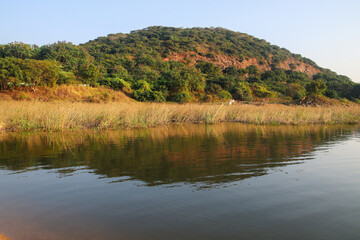 Hill and its reflection in the palaru river in chengalpet city tamil nadu (palaru translation milk...