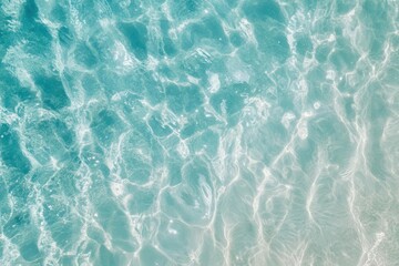 Obraz premium clear turquoise ocean waves glistening under sunlight, creating a serene beach scene with a sense of relaxation and the beauty of coastal life