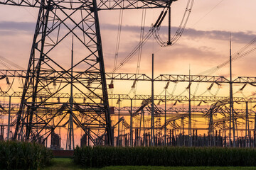 The pylons are in the evening, Substation in the evening, High voltage substation and beautiful sunset glow