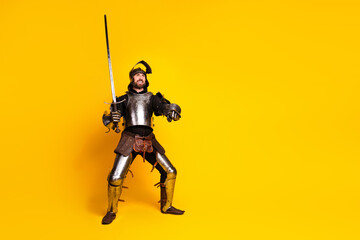 Medieval knight in armor holding a sword on a bright yellow background exuding confidence and...
