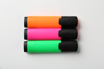 Bright highlighters on white background, flat lay
