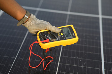 Technician in a solar panel powerhouse in Gounsoe village, Dassa, Collines, Benin