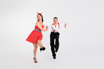 Photo of funny cheerful couple professional choreographers in dance studio isolated on white color...