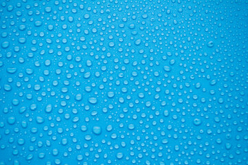 Clear water droplets with ocean blue background. Suitable for wallpaper cover design