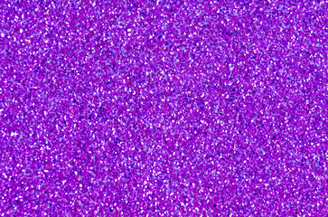 Close up of a purple glitter or sparkle texture and can be used as a background or wallpaper for designs