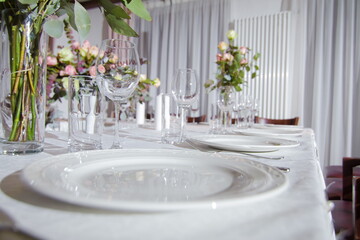 Festive table decorations, flowers and tableware, beautiful table setting for guests