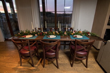 Decorative elements for festive events, home decorations. Festive table decorations, flowers and tableware