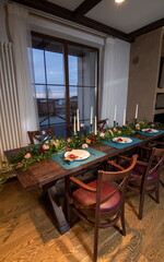 Decorative elements for festive events, home decorations. Festive table decorations, flowers and tableware