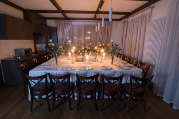 Decorative elements for festive events, home decorations. Festive table decorations, flowers and tableware
