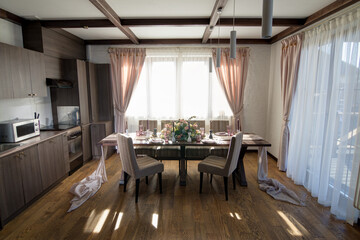 Decorative elements for festive events, home decorations. Festive table decorations, flowers and tableware