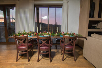 Decorative elements for festive events, home decorations. Festive table decorations, flowers and tableware