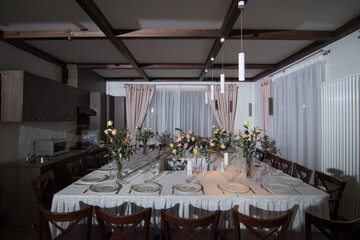 Decorative elements for festive events, home decorations. Festive table decorations, flowers and tableware