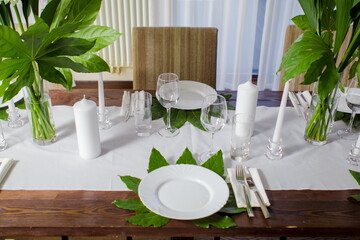 Festive table decorations, flowers and tableware, beautiful table setting for guests