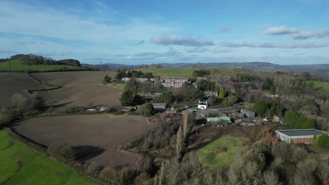 Seale-Hayne, Devon, England: DRONE VIEWS: The drone flies over farm fields towards the village of Seale-Hayne and its college, which was a former agriculture college operating from 1919 until 2005 (1)