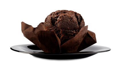 Chocolate muffin on black plate isolated on white background.