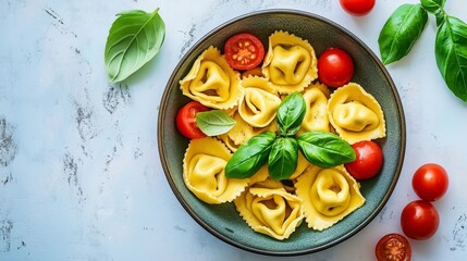 A vibrant overhead shot of tortellini in a bowl, garnished with fresh basil leaves and cherry tomatoes, emphasizing the colorful presentation and freshness of the dish.