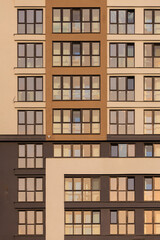 City view on a sunny day. Modern buildings, walls and windows. 