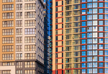 City view, modern buildings and skyscrapers against the blue sky.