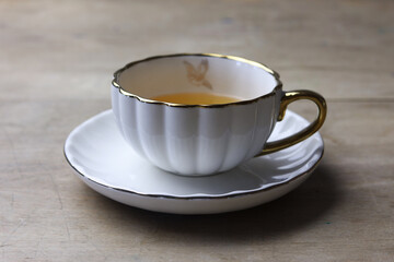 Cup of tea on a wooden table. Selective focus.