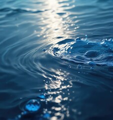 Macro shot of a natural background with a blue water splash creating ripples on the surface of the water, water, river, water movement