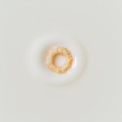 A single cereal loop floating above a milk ripple