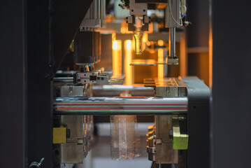 The operation of plastic bottle blowing machine.