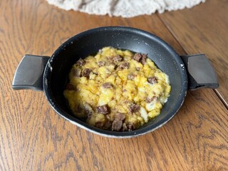 Kuymak muhlama with roasted meat kavurma in pan