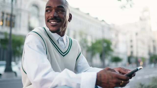 Focused African American man browsing online social media on his smartphone app, staying connected and engaged in digital world. Technology enables seamless interaction and entertainment on the go
