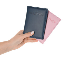 Obraz premium Woman holding passports in color covers on white background, closeup