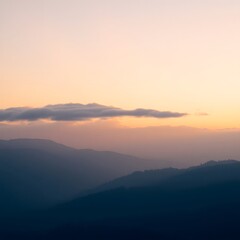 Fototapeta premium A serene and majestic sunrise unfolds over a range of misty mountains