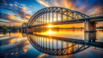 Naklejka premium Steel Bridge Spanning River at Sunset, Bokeh Background
